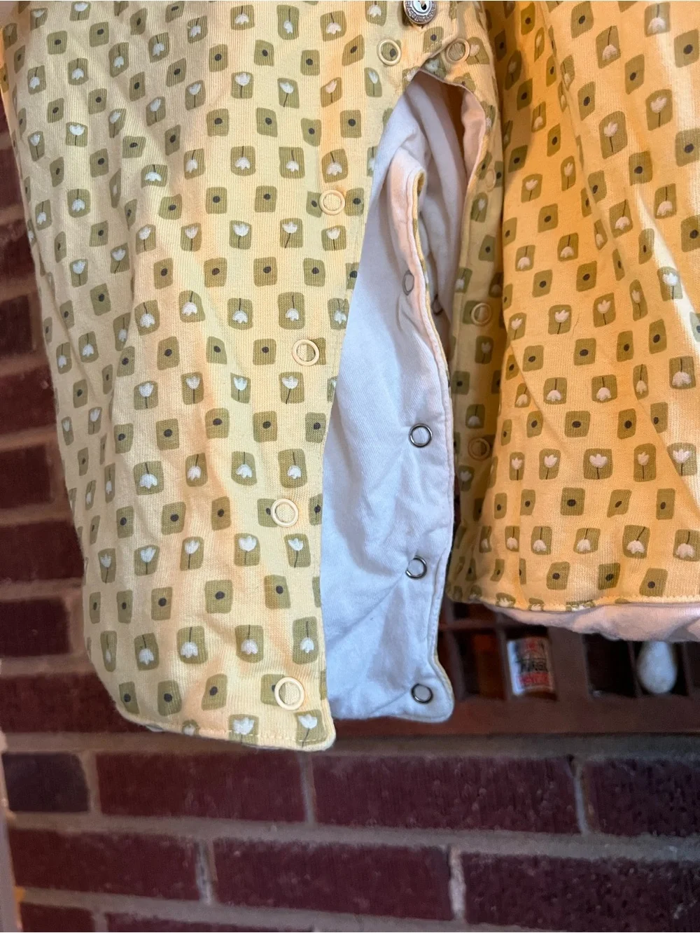 Lullaby Club Yellow Tulip Collar Baby onesie. Double layered